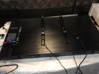 Rails on back of TV with release cords.jpg