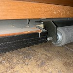 J - Roller bracket stripping screws out, forcing trim upward.jpg