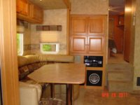 2008 Cyclone 3210 dinette and entertainment center.JPG